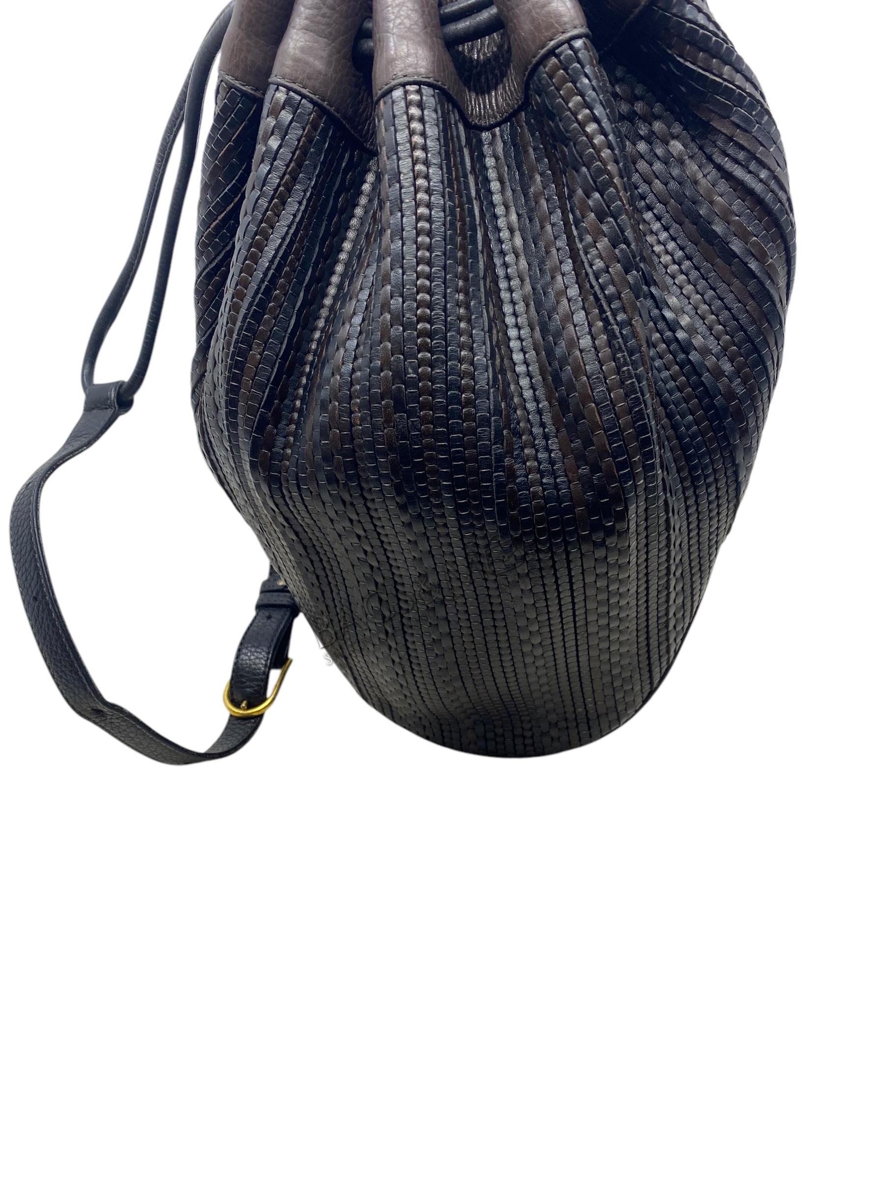 Delvaux Tabarin PM toile de cuir kleuren bruin en zwart met golden hardware